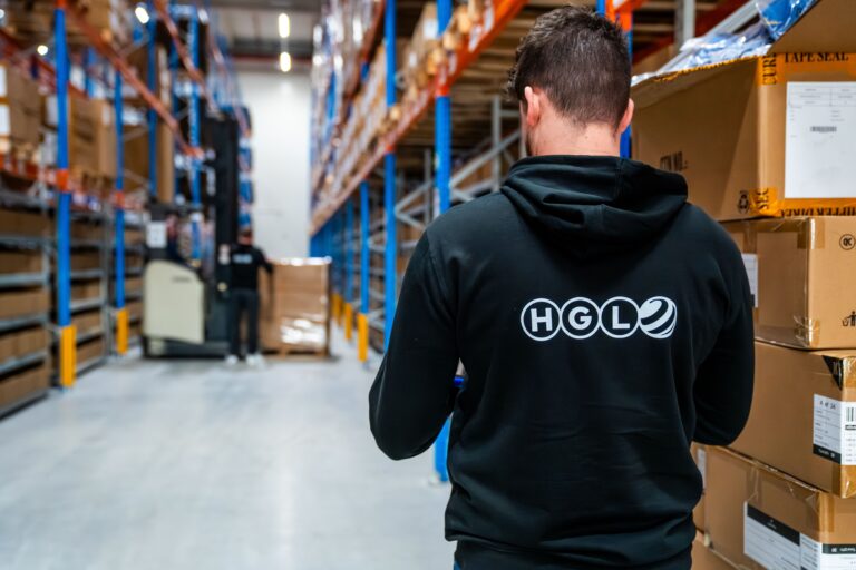 Warehousing and fulfillment services in Hungary — HGL warehouse worker handling e-commerce orders