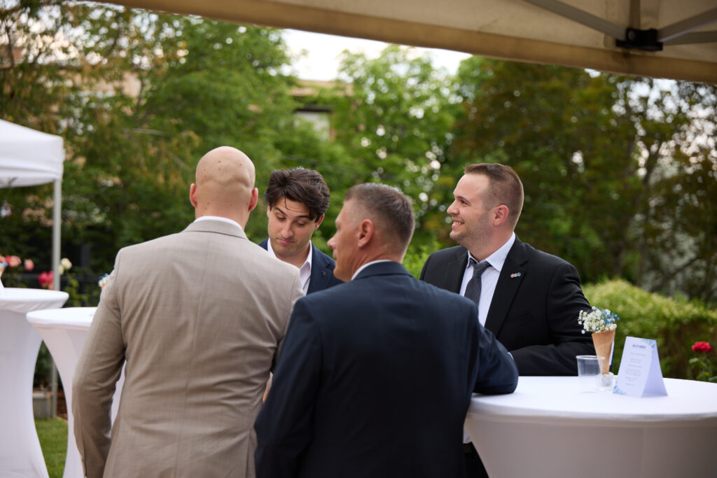 HGL Group colleagues in conversation with guests during the garden party reception at the British Ambassador's Residence.