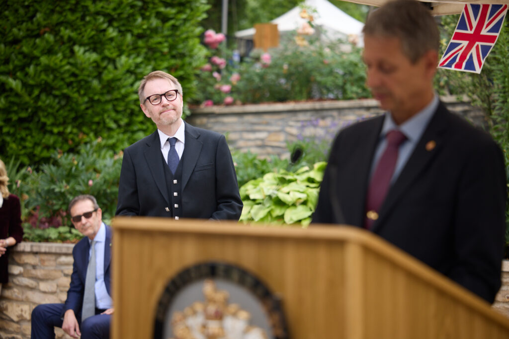 The official welcoming address and ceremonial speeches in the garden of the British Residence.